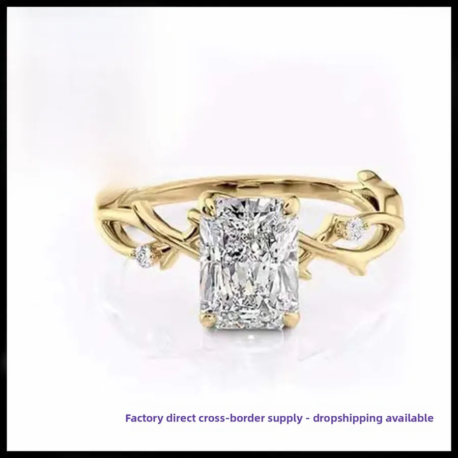 Gold ring with a large diamond on a white background