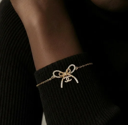 Elegant Ribbon Bow Bracelet – Gold-Tone with Crystal Accents