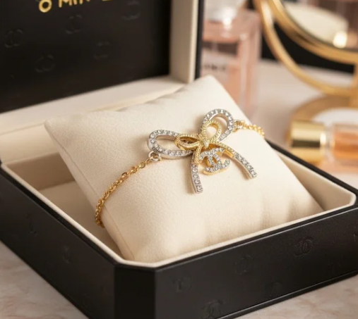 Elegant Ribbon Bow Bracelet – Gold-Tone with Crystal Accents