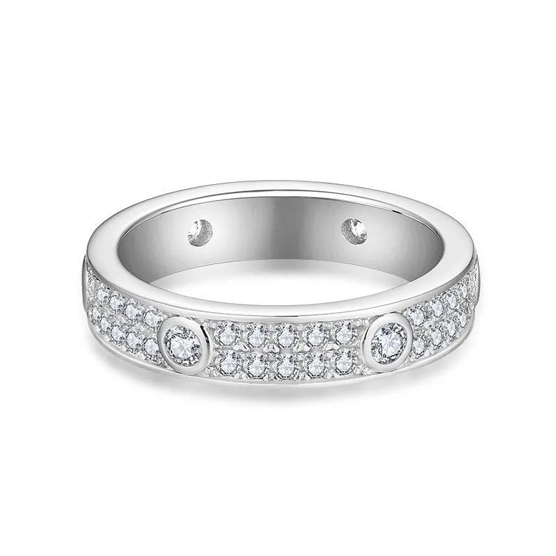 Silver ring with embedded diamonds on a white background