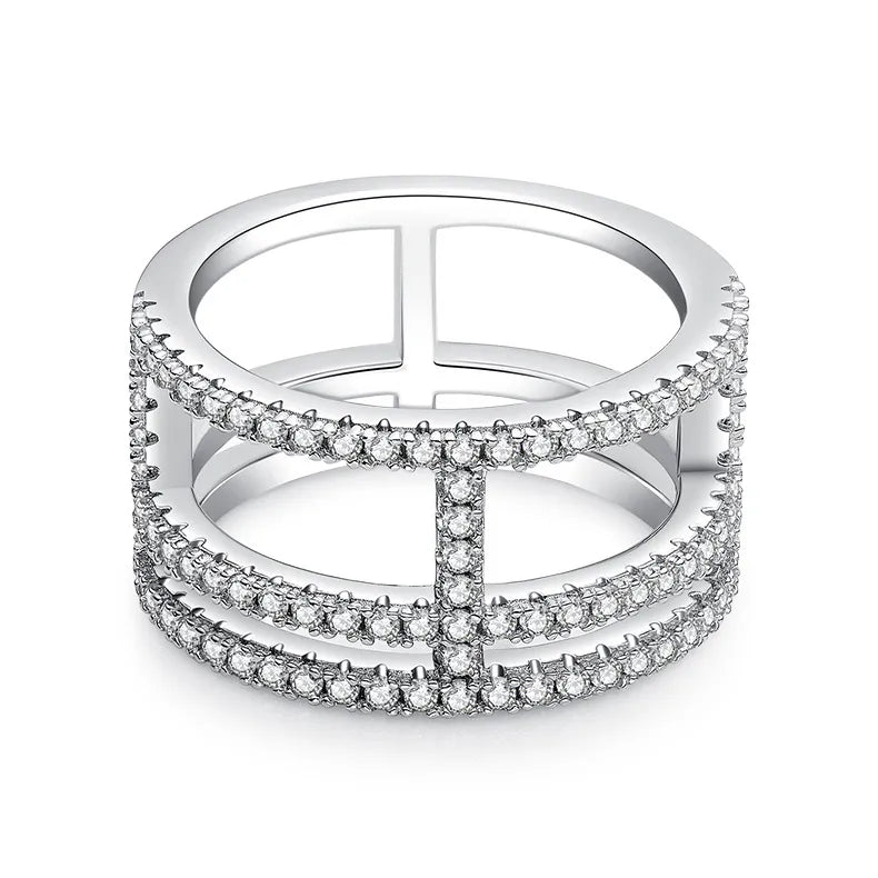 Silver ring with multiple layers of diamonds on a white background