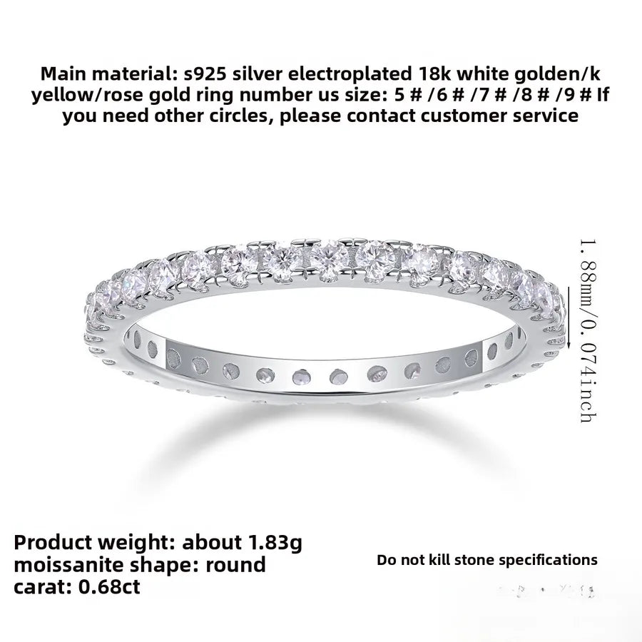 Silver ring with diamond-like stones on a white background