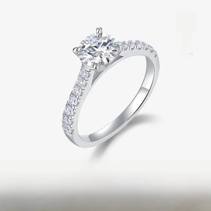 Silver ring with a diamond on a light gray background