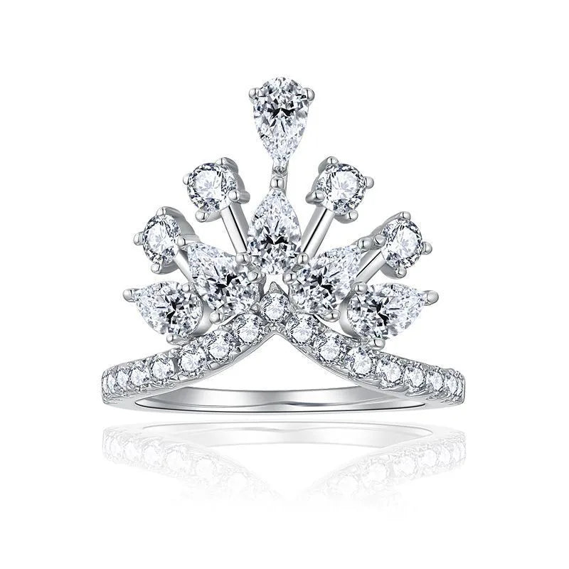 Diamond ring with a crown design on a white background